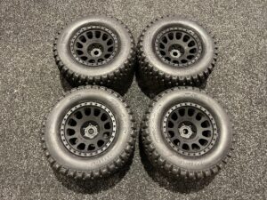 2x traxxas tires & wheels, assembled, glued (xrt race black wheels, gravix tires, foam inserts) (left & right) als nieuw!!