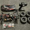 team magic e5 hx 4wd elektro monster truck brushless 2.4ghz met luxe aluminium dempers!