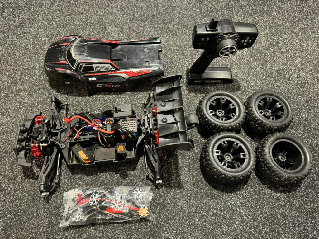 team magic e5 hx 4wd elektro monster truck brushless 2.4ghz met luxe aluminium dempers!