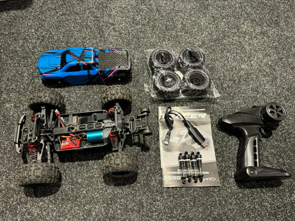 ftx tracer 1/16 4wd brushless electro monster truck rtr met luxe tuning veren en extra set banden in een prima staat!