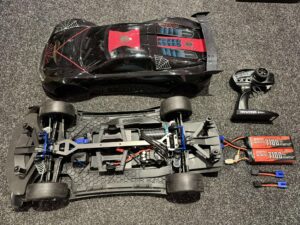 traxxas xo 1 supercar rtr tsm 2.4ghz in de kleur zwart/rood met 2x 7100mah 3s lipo batterijen (gebruikt maar in orde)!