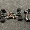 onroad 1/10 chassis zonder body met banden + brushless motor en regelaar + servo + zender set (niet compleet / gebruikt)!