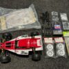 kyosho turbo optima 4wd + extra kyosho body + extra set luxe dempers + tamiya toolset + xtra speed tuning onderdelen + extra set velgen helemaal nieuw!