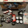 team associated rb10 1/10 buggy rtr red + extra set schumacher banden echt als nieuw!